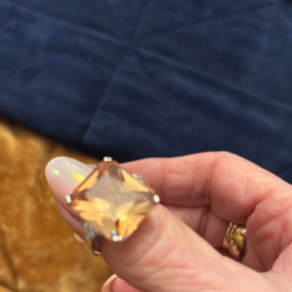 Elegant Gold-Toned Ring with Amber Stone